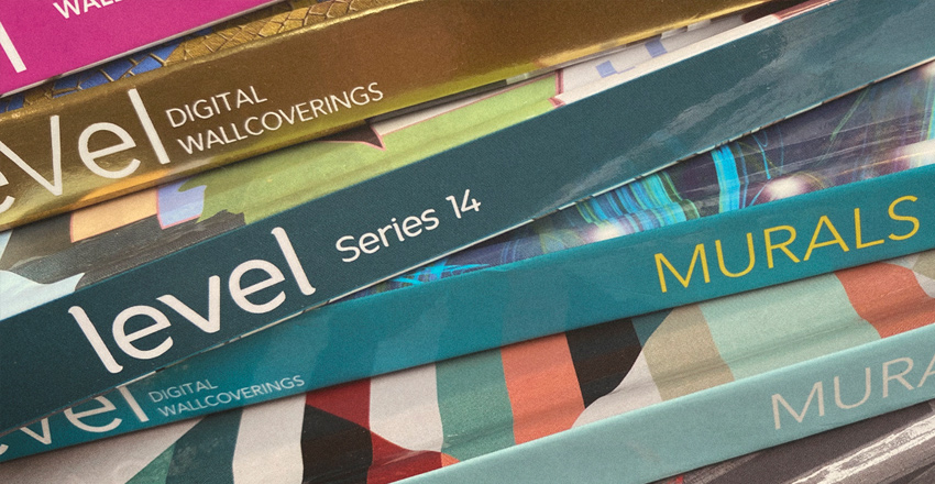 colorful Level printed catalogs stacked up, spines facing out